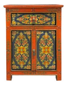 an orange and blue cabinet with flowers painted on the front, two doors at the bottom