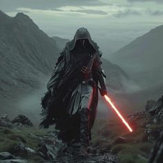 darth vader in the mountains with his lightsaben on, looking at something