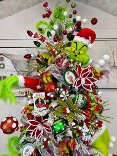 a christmas tree decorated with green and red ornaments