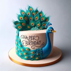 there is a birthday cake with a peacock on it