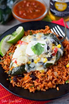 mexican rice and beans on a black plate