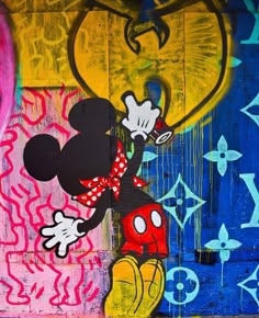 a mickey mouse painting on the side of a building