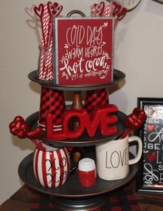 two tiered trays with valentine's day decorations and coffee mugs on top