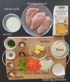 ingredients to make chicken pot pie laid out on a cutting board