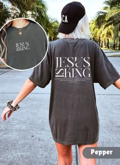 Introducing the Bible Verse T-shirt Jesus is King, a must-have for anyone seeking to spread the message of faith in style! This Comfort Colors Christian Shirt Crewneck makes the perfect Christian Gift for friends, family, or yourself. Runs true to size but size up if you would like a more oversized fit. Please check photo cards for detailed size guide. Comfort Colors®1717 is a made 100% with US cotton for long-lasting comfort. The soft-washed, garment-dyed fabric brings extra coziness to your wardrobe while the relaxed fit makes it an excellent daily choice.  Our designs are printed using the highest quality professional direct-to-garment (DTG) process, meaning fabric-grade ink is printed directly onto the garment and seamlessly blends with the fibres. This method enables us to achieve a v Christian Gift Shop, Christian Shirts Designs, Jesus Is King, Church Shirt, Bible Verse Shirt, King Tshirt, Jesus Shirt, Christian Sweatshirt, Christian T Shirt