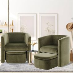 a living room with two green chairs and a small round table in front of them