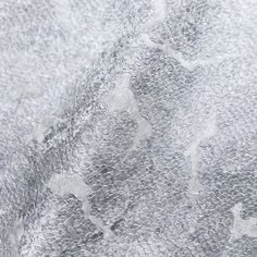 the texture of an abstract painting is gray and white