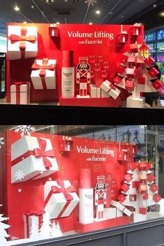 the window display is decorated with red and white boxes, presents, and snowflakes