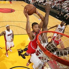 the basketball players are playing on the court