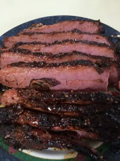 some meat is sitting on a plate and ready to be cooked in the oven for consumption