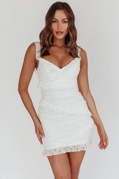 Lace mini dressFully linedFrill trim detailOff-shoulder styleInvisible zip at backYou'll be livin' la vida loca in this super cute dress. We are obsessed with the lace overlay and adorable frill trim. Perfect for a bachelorette or an extra special birthday party. Team it with white, strappy heels and a clutch for a white-hot look.CAREHand Wash Cold. Do Not Iron.MATERIALSPANDEX/POLYESTER