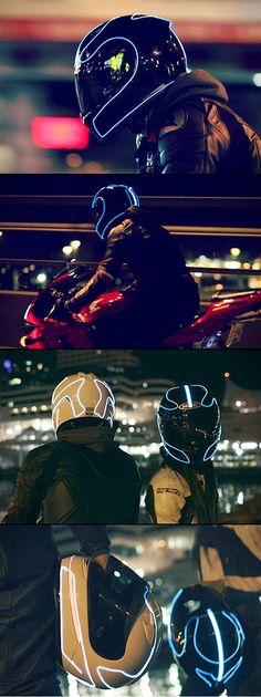 two people wearing helmets sitting in the back of a car at night and one person riding on a motorcycle