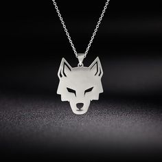 In Norse Mythology, Fenrir is a monstrous wolf fathered by the God, Loki. He was raised in Asgard initially as a harmless creature. However, he soon grew into a giant monster that worried even the Gods themselves. This necklace is made of solid Stainless Steel that will never rust or lose its color. Pendant Material: Stainless Steel Chain Material: Stainless Steel Symbol: Fenrir Chain Type: Link Chain Pendant Color: Steel or Gold Plated Chain Color: Steel or Gold Plated Chain Length: 52cm | 20.5 Wolf Accessories Jewelry, Nordic Wolf, Cat Necklace Gold, Wolf Necklace, Wolf Head, Unisex Necklace, Pattern Animal, Cat Necklace, Stainless Steel Pendant