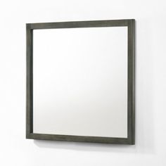 a mirror mounted to the side of a wall