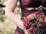 a woman in a dress holding a bouquet of flowers