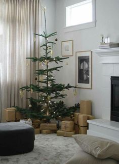 a living room with a christmas tree in the corner