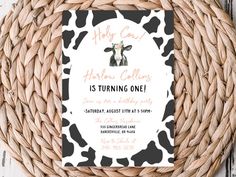 a birthday party card with a cow pattern on the front and bottom, in black and white