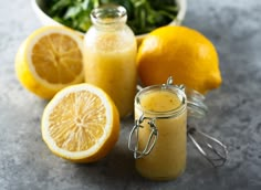 there are lemons, spinach and other ingredients on the counter top next to each other