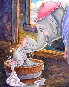 an elephant and baby elephant playing in a tub