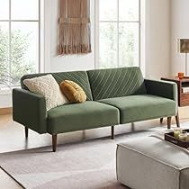 a living room scene with focus on the couch and coffee table in the foreground