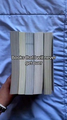 someone is holding an open book with the words books that i will never get over