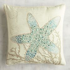 a starfish pillow on a white background