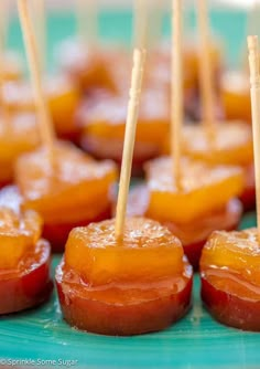 small desserts with toothpicks in them sitting on a table