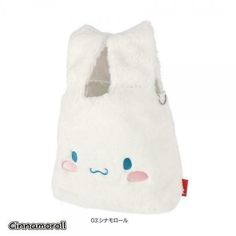 a small white bag with blue eyes and ears