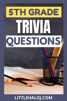 a desk with books, pencils and an open book on it that says 5th grade trivia questions