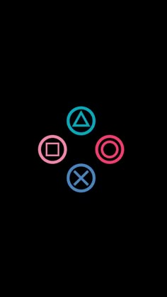 four different colored circles in the middle of a black background with an x on it