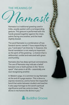 the meaning of namaste is displayed on a white board with beads and tassels