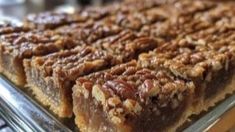 several pieces of pecan pie sitting on top of a metal tray