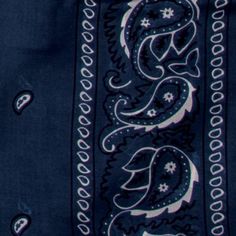 a close up of a blue and white paisley pattern on a black shirt with buttons