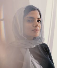 a woman wearing a white scarf around her head