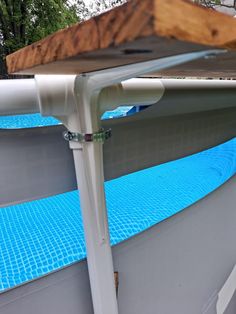 an above ground swimming pool with blue water