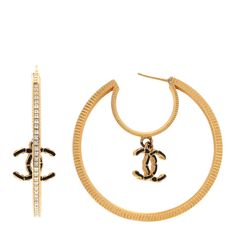 This is an authentic CHANEL Baguette Crystal CC Drop Hoop Earrings in Gold. These stylish hoop earrings feature a gold crystal-encrusted hoop with a black resin threaded CC logo hanging in the center. Drop Hoop Earrings, Hoop Earrings Gold, Black Resin, Earrings In Gold, Gold Crystal, Cc Logo, Earrings Gold, A Black, Gold Earrings