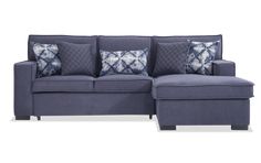 a blue sectional sofa with pillows on it