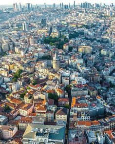 an aerial view of a city with lots of tall buildings