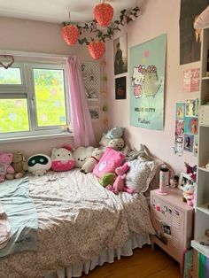 a bedroom with pink walls and lots of stuffed animals on the bed in front of a window