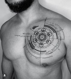 a man with a tattoo on his chest has circles and lines in the shape of hexagons