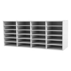 a white shelf with many compartments on it