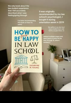 someone is holding up a book in their hand that says how to be happy in law school