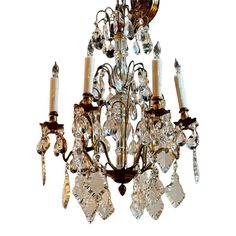 a chandelier with several crystal pieces hanging from it