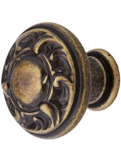 an old door knob with ornate designs on it