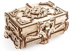 an intricately carved wooden box is shown on a white background with the lid open