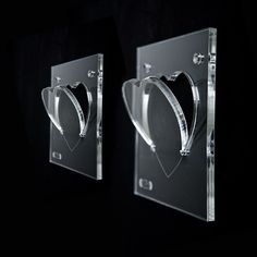 two glass plaques with hearts on them in the shape of heart's and arrow's