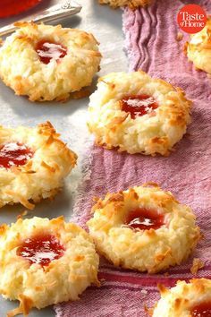 some biscuits with jam on them sitting on a towel