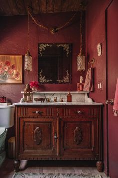 a bathroom with a sink, toilet and mirror in it's centerpieces