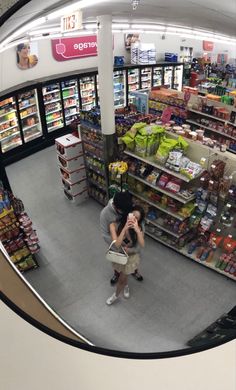 an aerial view of a grocery store looking down at the aisles