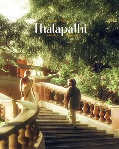 two people walking up some stairs in front of trees and bushes, with the words thaapafin written above them